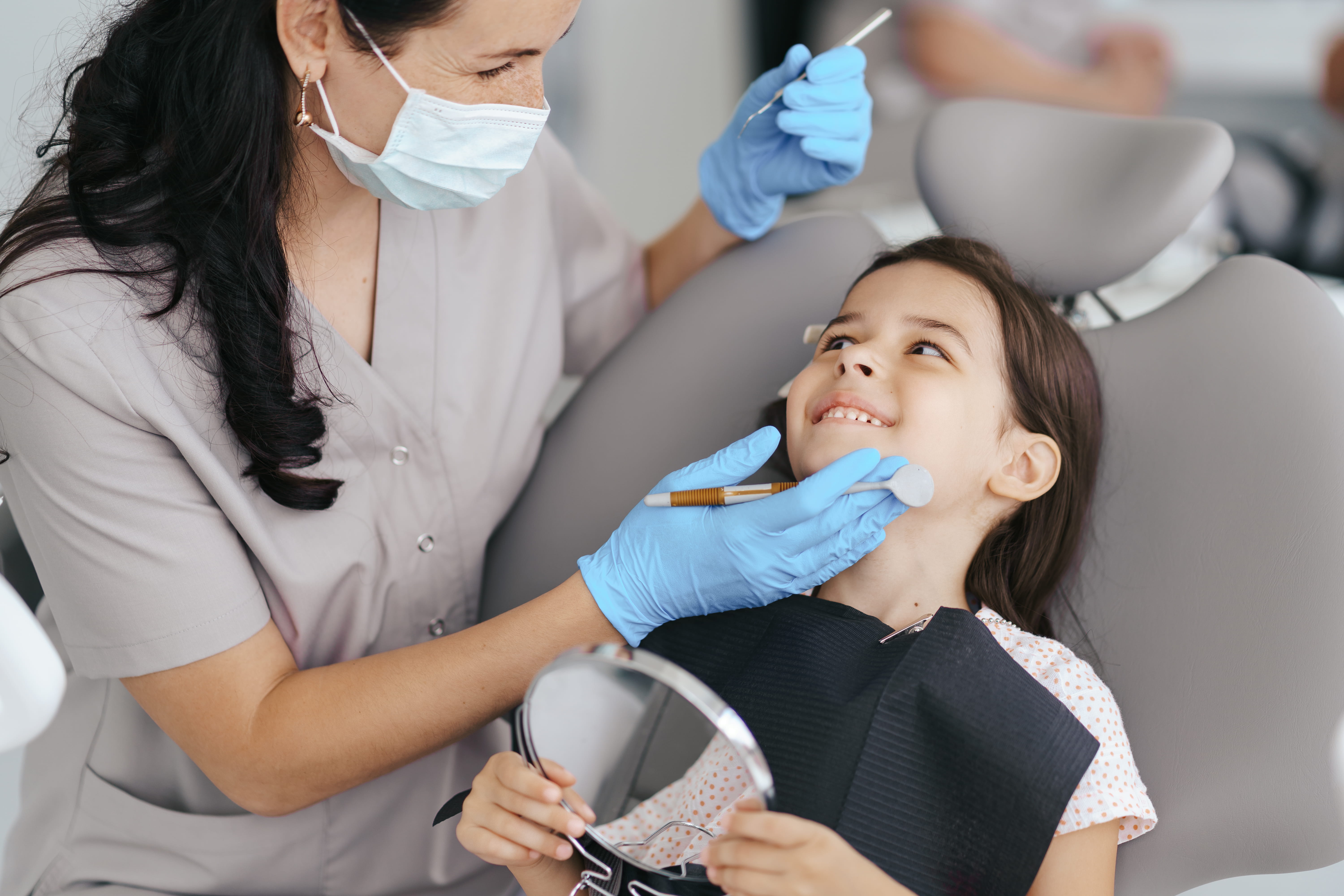 Dentist treating patient